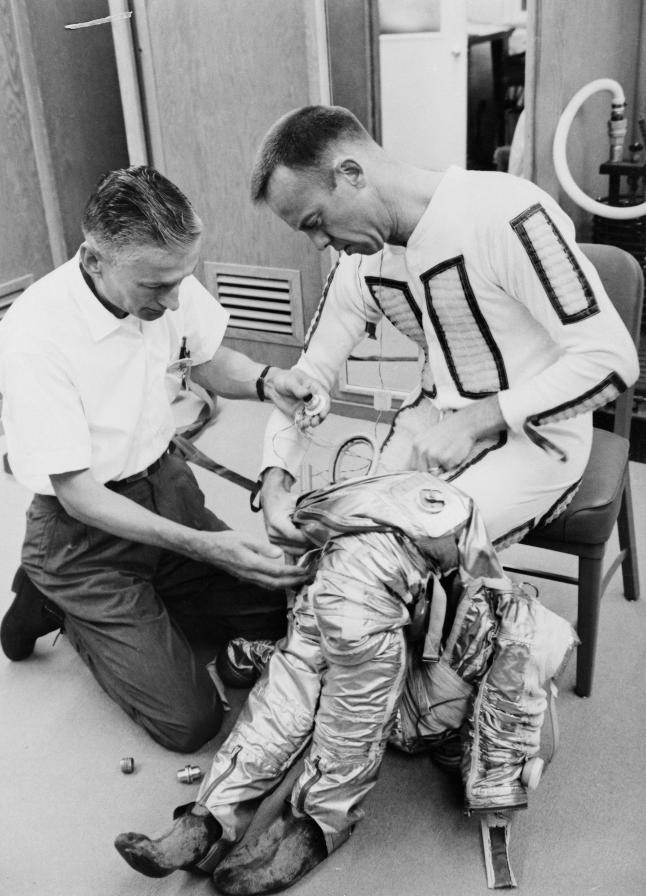 Alan Shepard donning his Project Mercury space suit