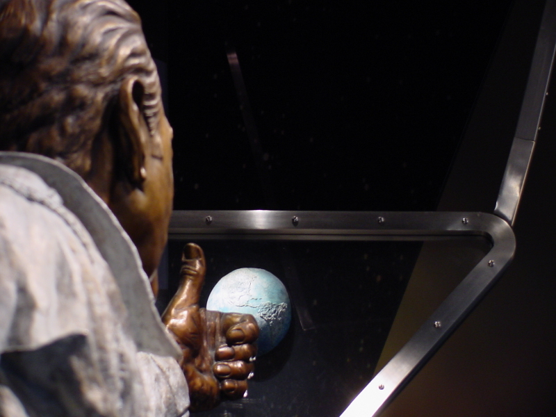 Jim Lovell "Quest for Exploration" Statue looking out the window at the Earth at Adler Planetarium