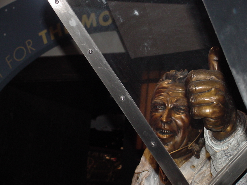 Jim Lovell "Quest for Exploration" Statue looking out the window at the Earth at Adler Planetarium