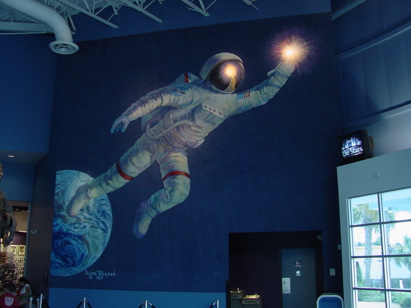 Alan Bean Reaching for the Stars painting on wall of Astronaut Hall of Fame lobby