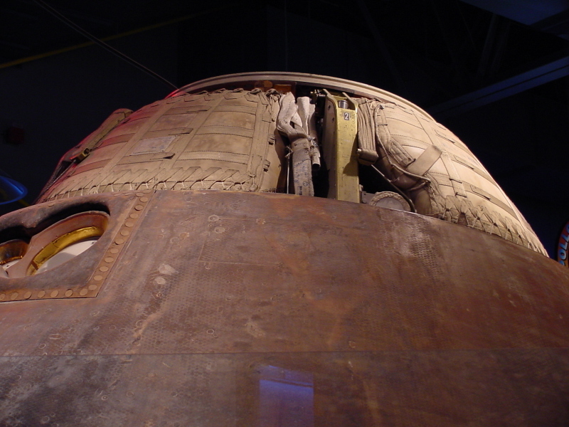 Apollo 14 command module earth landing system, including parachute bags, at Astronaut Hall of Fame