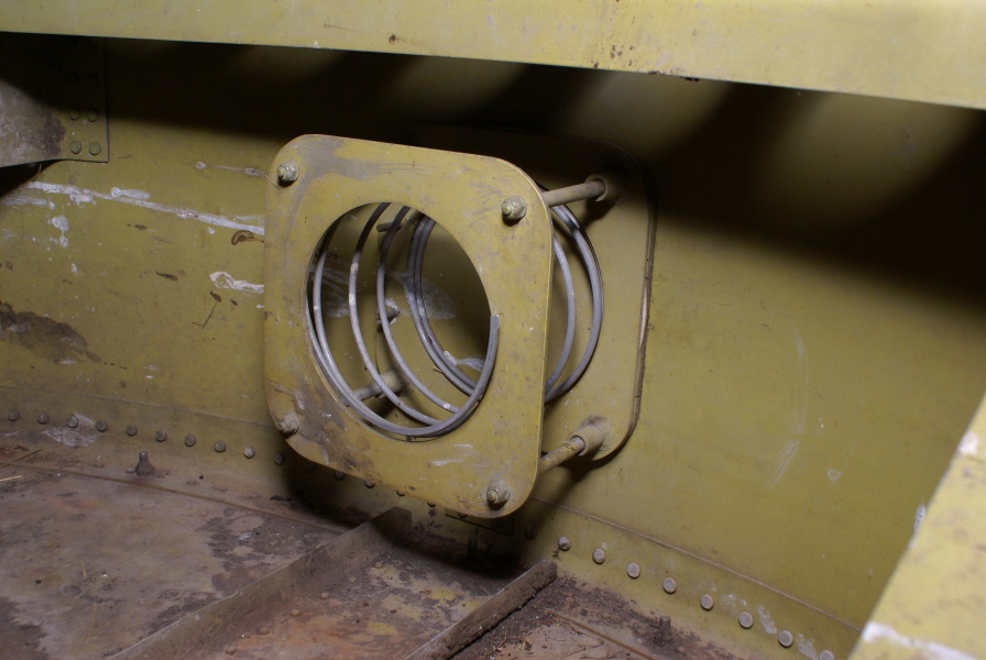 Spring-mounted bracket in interior of Redstone Tail Unit at Air Zoo