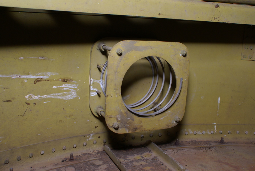 Spring-mounted bracket in interior of Redstone Tail Unit at Air Zoo