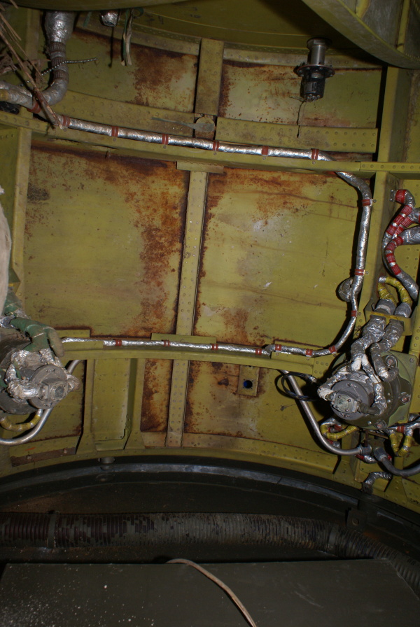 Interior of Redstone Aft Unit skirt section, including air vane actuator, electrical connector bracket, jet vane pressure regulator, and high-pressure air spheres at Air Zoo