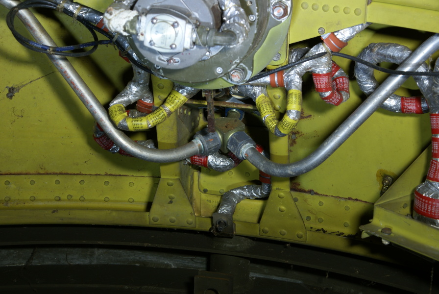 Pressure regulator and jet nozzle gas lines in interior of Redstone Aft Unit skirt section at Air Zoo