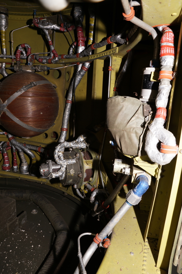 Interior of Redstone Aft Unit skirt section, including air vane actuator, electrical connector bracket, jet vane pressure regulator, and high-pressure air spheres at Air Zoo