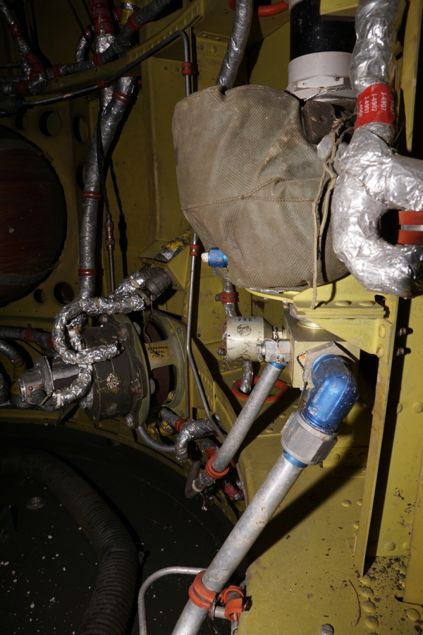 Pressure regulator and jet nozzle gas lines in interior of Redstone Aft Unit skirt section at Air Zoo