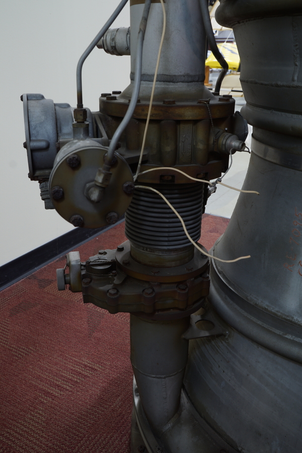 Main fuel valve, mixture control valve, and fuel inlet manifold on A-7 Engine ("As Removed") at Air Zoo