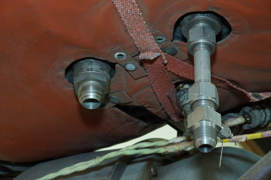 Hydrogen peroxide (h2o2) tank fill/drain fittings on A-7 Engine ("As Removed") at Air Zoo