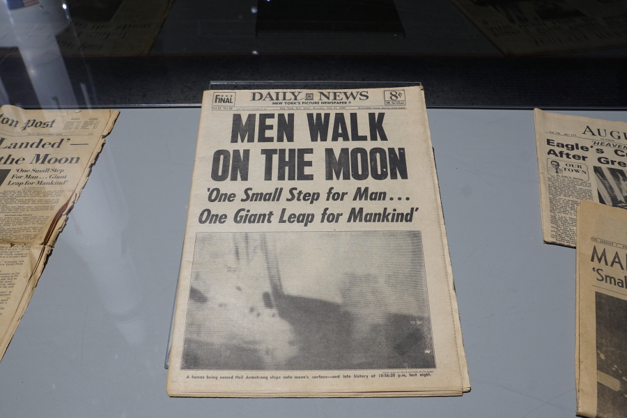 Men Walk on the Moon newspaper headline in the Apollo:  When We Went to the Moon exhibit