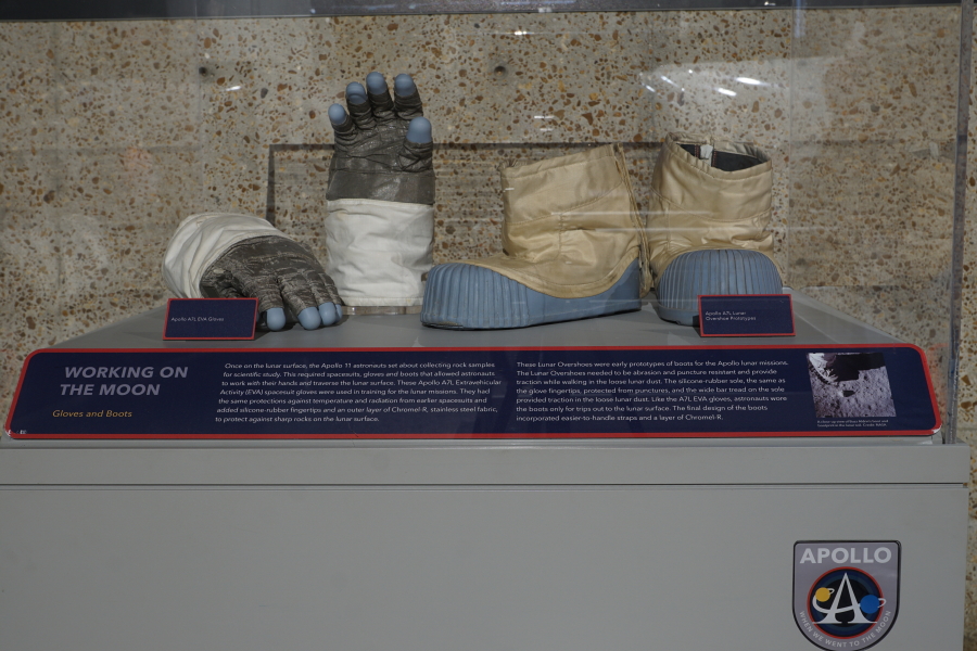 Display case with Apollo A6L Lunar Overboots and Apollo A7L EVA gloves at Apollo:  When We Went to the Moon