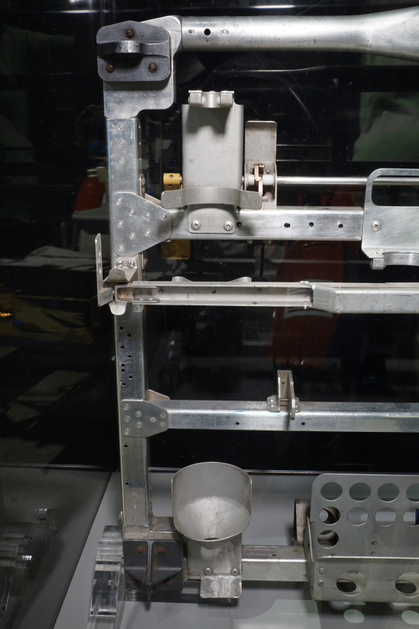 Latch ear, gnomon cup and flat sample bag dispenser bracket on Lunar Hand Tool Carrier at Apollo:  When We Went to the Moon