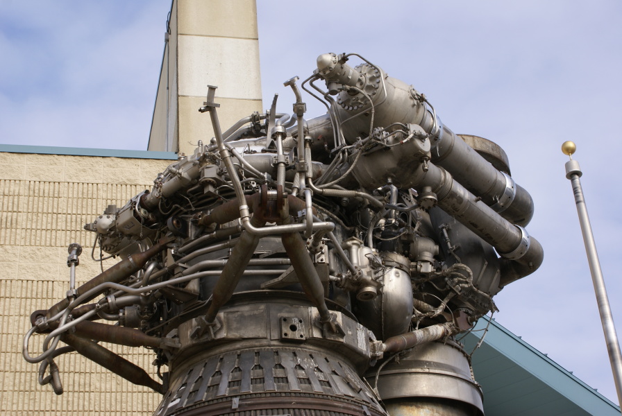 Forward end of F-1 Engine at Kansas Cosmosphere, including interface panel, fuel inlet elbows, turbopumps, LOX high-pressure duct, and fuel (RP-1) high-pressure-duct