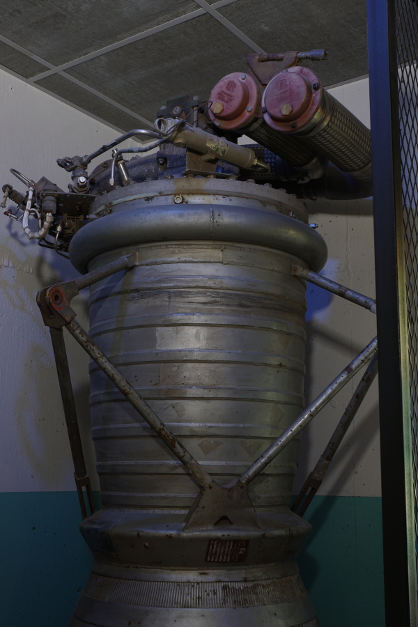 Forward end of LR-89 (Atlas Booster) Engine, including combustion chamber, propellant (LOX/RP-1) high-pressure lines, hypergol manifold, and gimbal actuator outrigger at Kansas Cosmosphere