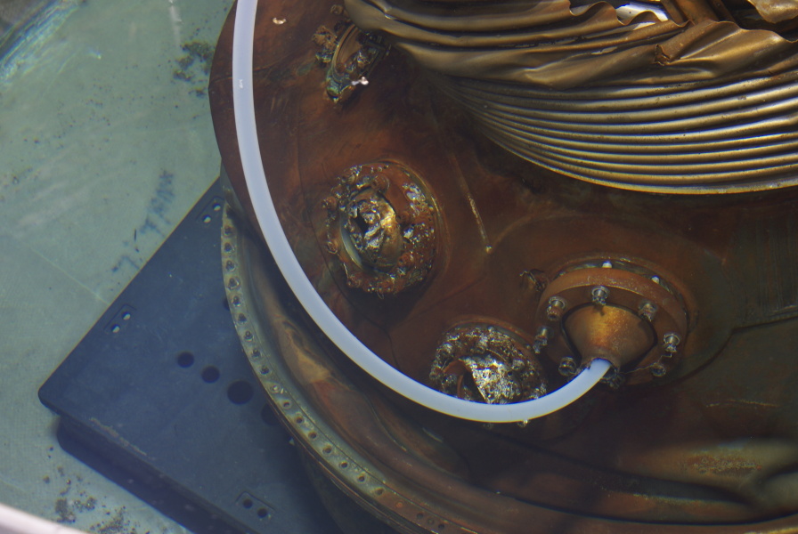 Helium and oxygen entry and exit ports on heat exchanger from Jeff Bezos recovered F-1 Apollo 11 rocket engines