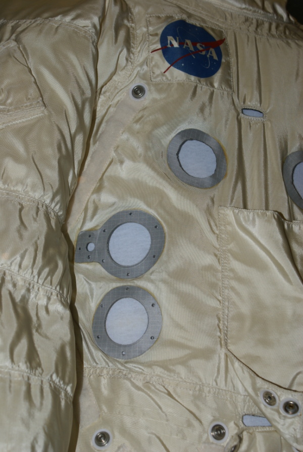 Chest connector holes on Apollo A7L Suit integrated thermal micrometeoroid garment (ITMG) at Franklin Institute