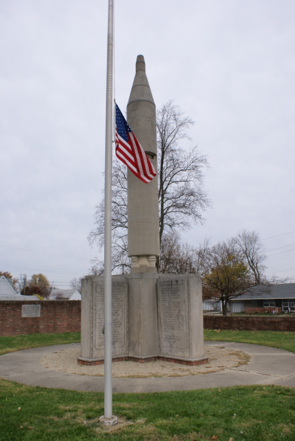 Grissom Monument with flag at half staff in Mitchell Indiana