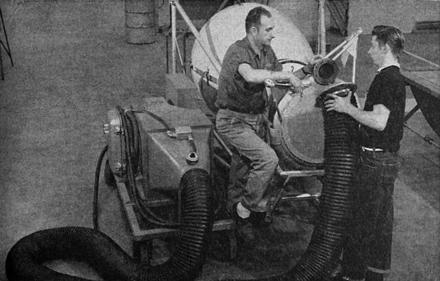 Thor, Jupiter, Atlas thrust chamber dried with heater after cold-flow calibration at Rocketdyne Neosho Missouri