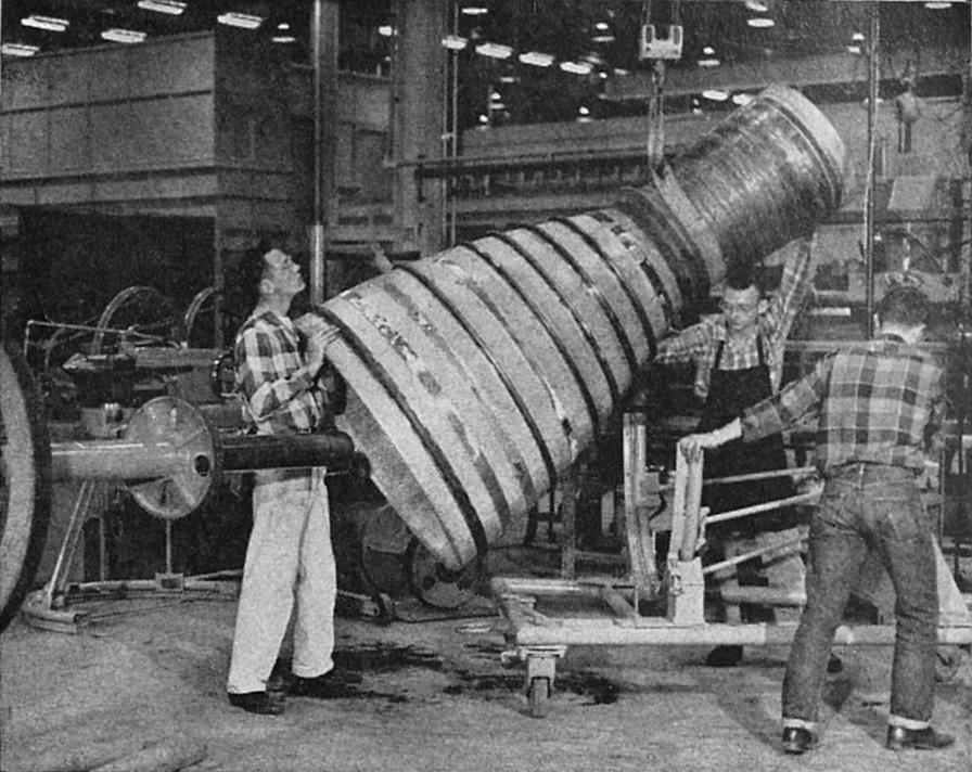 Thor, Jupiter, Atlas thrust chamber mounted on lathe for manifold preparation at Rocketdyne Neosho Missouri