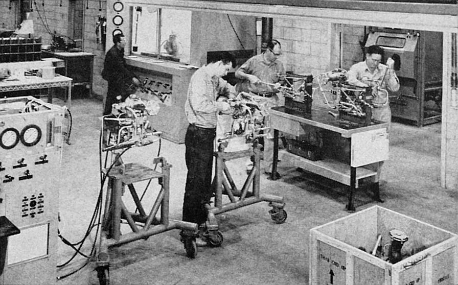 Workmen preparing Atlas/Thor LR-101 vernier rocket engines for shipment at Rocketdyne's Neosho Missouri Air Force Plant No. 65