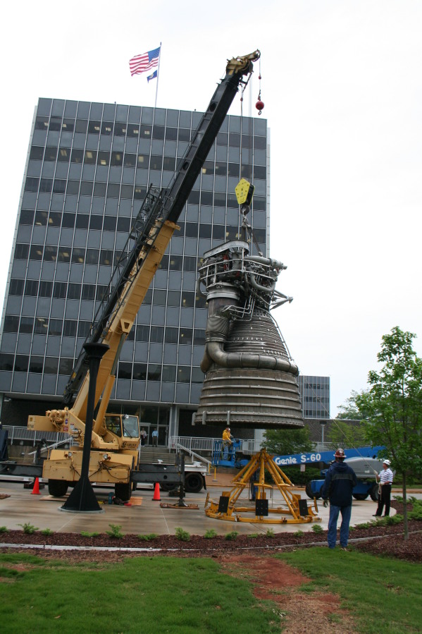 Placing F-1 rocket engine on throat support during Installation of Building 4200 Engines (May 13, 2008) at Marshall Space Flight Center Engine Displays