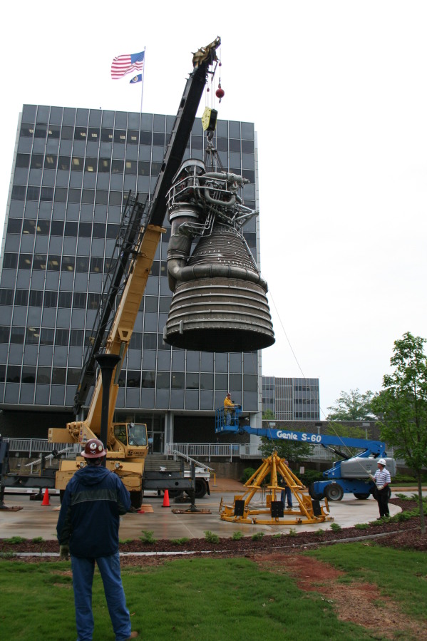 Placing F-1 rocket engine on throat support during Installation of Building 4200 Engines (May 13, 2008) at Marshall Space Flight Center Engine Displays