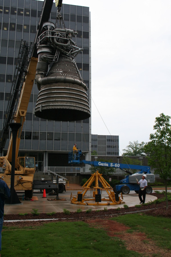 Placing F-1 rocket engine on throat support during Installation of Building 4200 Engines (May 13, 2008) at Marshall Space Flight Center Engine Displays