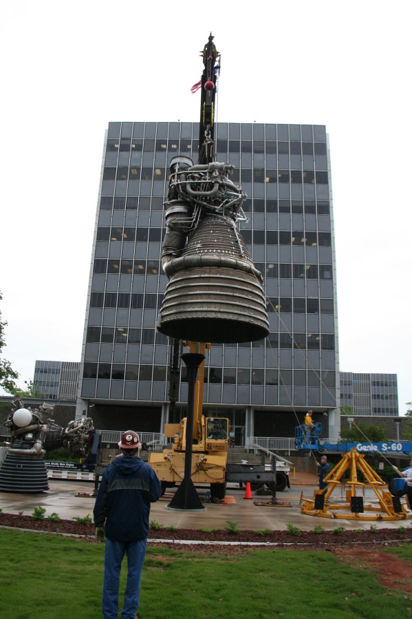 Placing F-1 rocket engine on throat support during Installation of Building 4200 Engines (May 13, 2008) at Marshall Space Flight Center Engine Displays