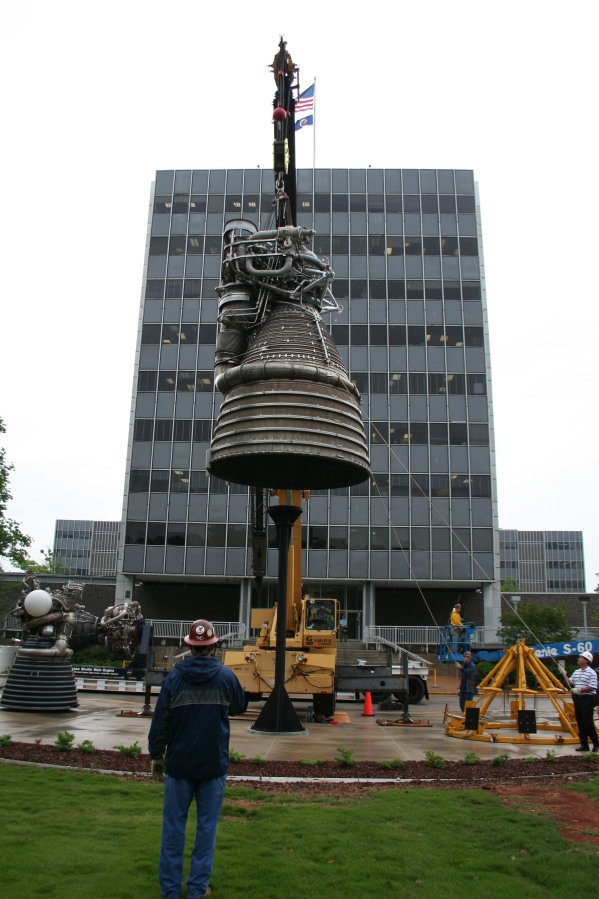 Placing F-1 rocket engine on throat support during Installation of Building 4200 Engines (May 13, 2008) at Marshall Space Flight Center Engine Displays