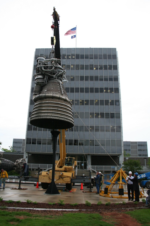 Placing F-1 rocket engine on throat support during Installation of Building 4200 Engines (May 13, 2008) at Marshall Space Flight Center Engine Displays