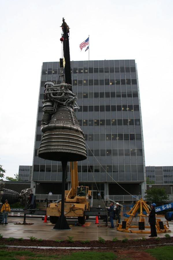 Placing F-1 rocket engine on throat support during Installation of Building 4200 Engines (May 13, 2008) at Marshall Space Flight Center Engine Displays