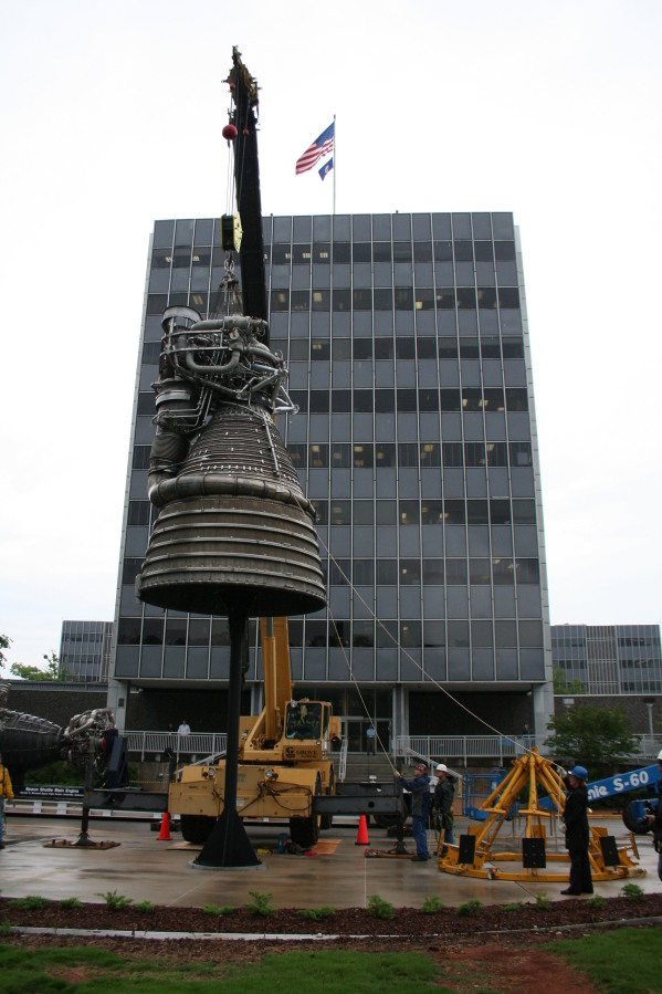 Placing F-1 rocket engine on throat support during Installation of Building 4200 Engines (May 13, 2008) at Marshall Space Flight Center Engine Displays