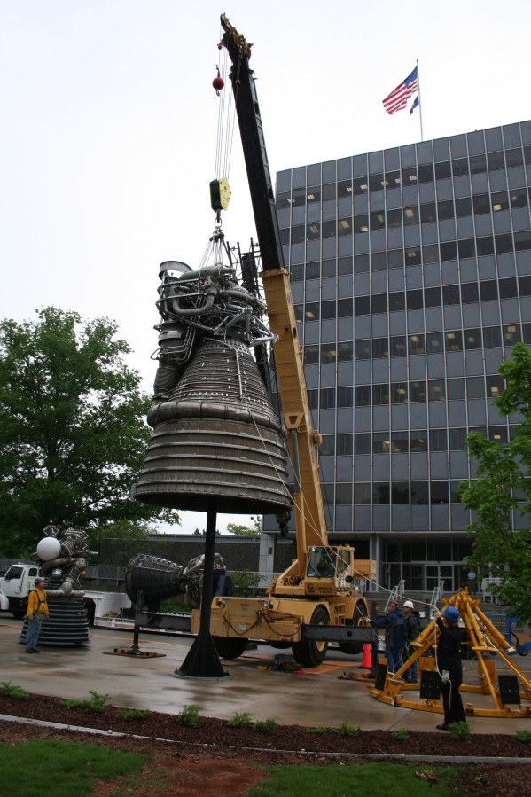 Placing F-1 rocket engine on throat support during Installation of Building 4200 Engines (May 13, 2008) at Marshall Space Flight Center Engine Displays