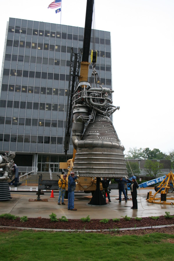 Placing F-1 rocket engine on throat support during Installation of Building 4200 Engines (May 13, 2008) at Marshall Space Flight Center Engine Displays