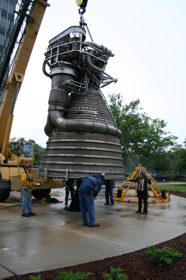Placing F-1 rocket engine on throat support during Installation of Building 4200 Engines (May 13, 2008) at Marshall Space Flight Center Engine Displays
