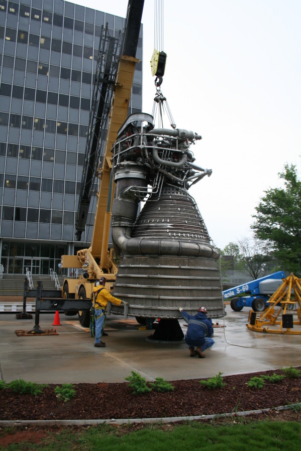 Placing F-1 rocket engine on throat support during Installation of Building 4200 Engines (May 13, 2008) at Marshall Space Flight Center Engine Displays