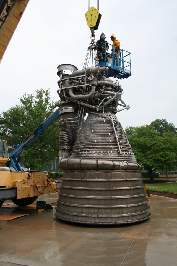 Removing crane hoist cable from F-1 rocket engine during Installation of Building 4200 Engines (May 13, 2008) at Marshall Space Flight Center Engine Displays