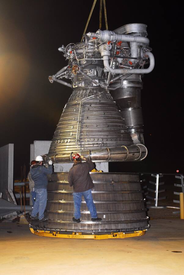 Lifting the F-1 rocket engine thrust chamber onto the nozzle extension during F-5036 Fit Test (March 6, 2008) at Marshall Space Flight Center Engine Displays