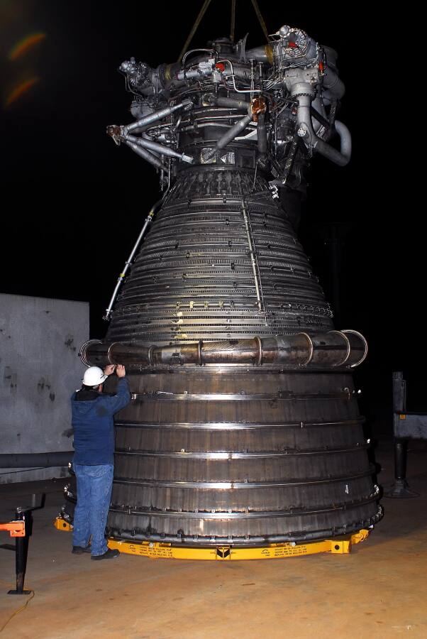 Bolting the nozzle extension to the F-1 rocket engine thrust chamber during F-5036 Fit Test (March 6, 2008) at Marshall Space Flight Center Engine Displays