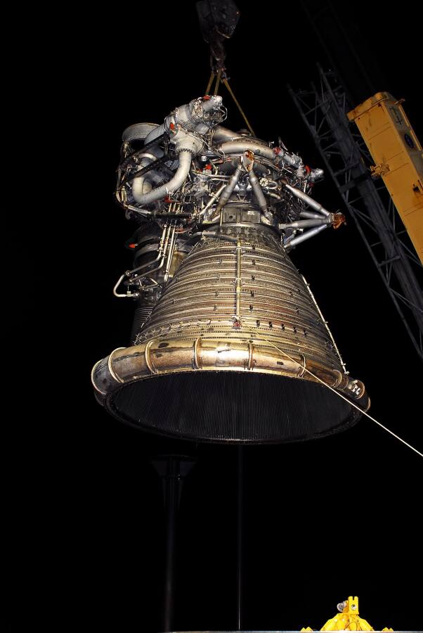 Lowering the F-1 rocket engine thrust chamber onto its throat support during F-5036 Fit Test (March 6, 2008) at Marshall Space Flight Center Engine Displays