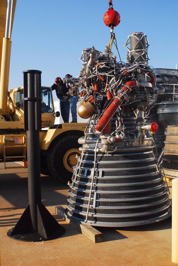 Lifting the J-2 rocket engine onto its throat support during Building 4200 J-2 Engine Fit Test (March 24, 2008) at Marshall Space Flight Center Engine Displays