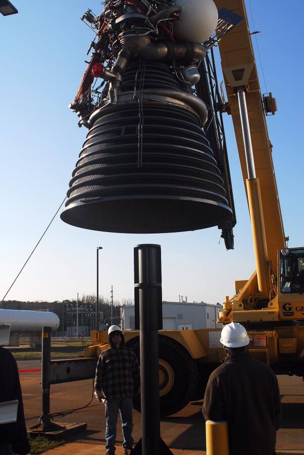Lifting the J-2 rocket engine onto its throat support during Building 4200 J-2 Engine Fit Test (March 24, 2008) at Marshall Space Flight Center Engine Displays