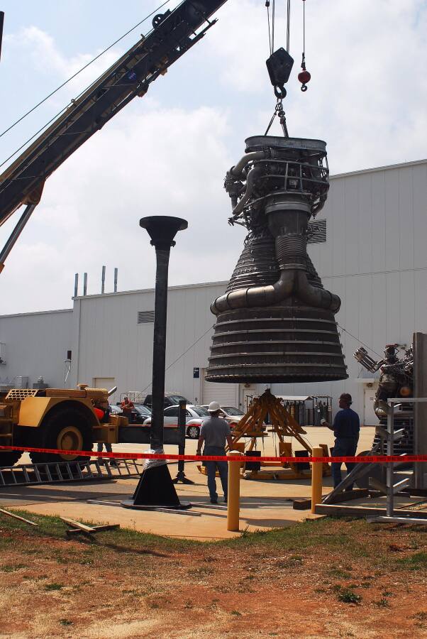 F-1 rocket engine being placed on its throat support during F-5036 Fit Test (April 7, 2008) at Marshall Space Flight Center Engine Displays