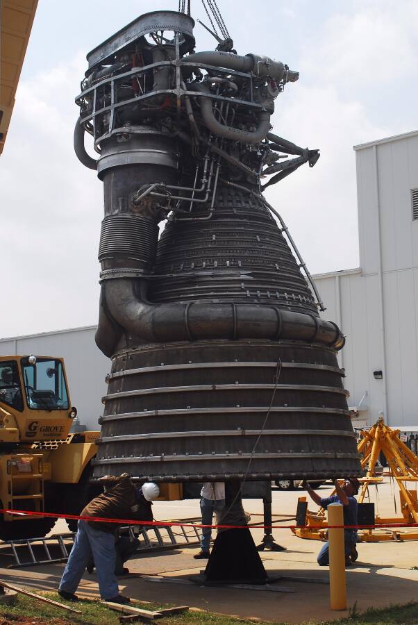 F-1 rocket engine being placed on its throat support during F-5036 Fit Test (April 7, 2008) at Marshall Space Flight Center Engine Displays