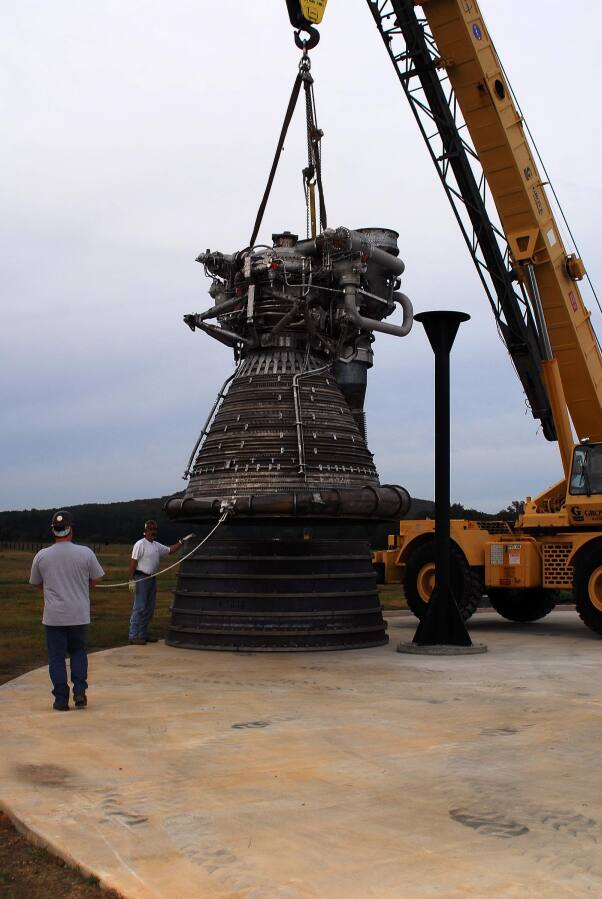 Placing the F-1 thrust chamber on the nozzle extension during F-4023 Installation at Building 4205 (October 21, 2009) at Marshall Space Flight Center Engine Displays