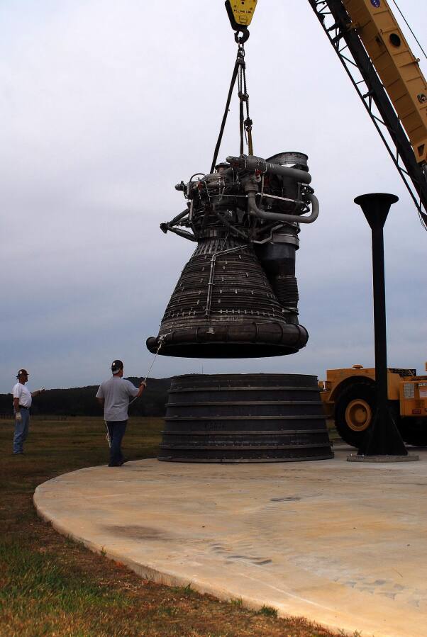 Placing the F-1 thrust chamber on the nozzle extension during F-4023 Installation at Building 4205 (October 21, 2009) at Marshall Space Flight Center Engine Displays