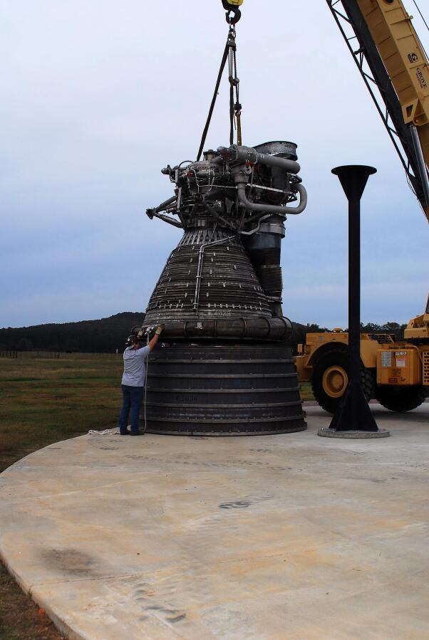 Placing the F-1 thrust chamber on the nozzle extension during F-4023 Installation at Building 4205 (October 21, 2009) at Marshall Space Flight Center Engine Displays