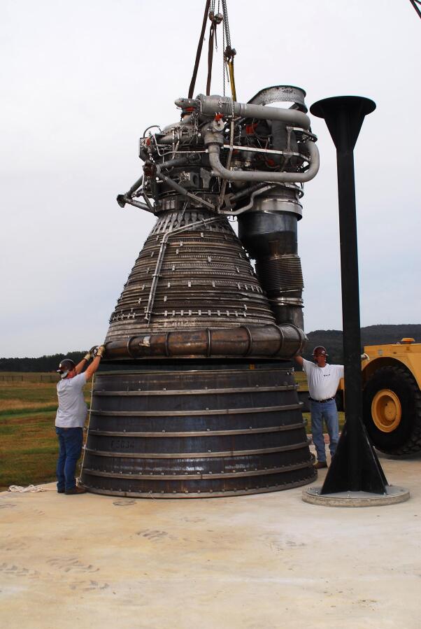 Placing the F-1 thrust chamber on the nozzle extension during F-4023 Installation at Building 4205 (October 21, 2009) at Marshall Space Flight Center Engine Displays
