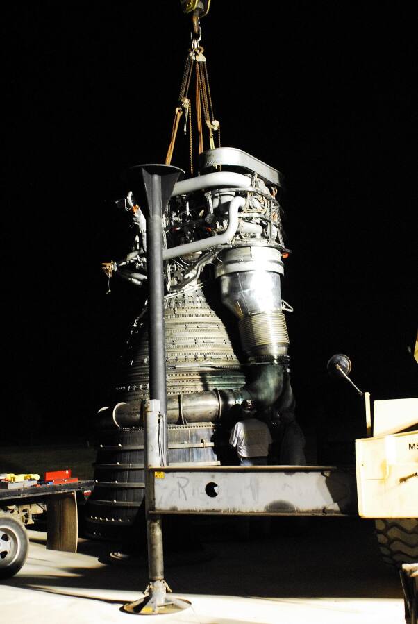 Bolting the nozzle extension to the F-1 thrust chamber during F-4023 Installation at Building 4205 (October 21, 2009) at Marshall Space Flight Center Engine Displays