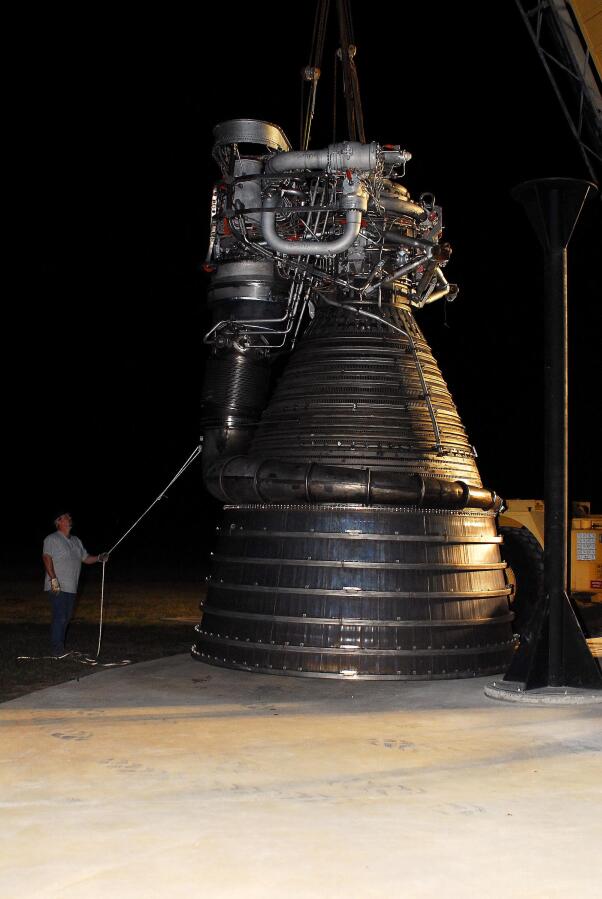 Lifting F-1 rocket engine onto throat support during F-4023 Installation at Building 4205 (October 21, 2009) at Marshall Space Flight Center Engine Displays